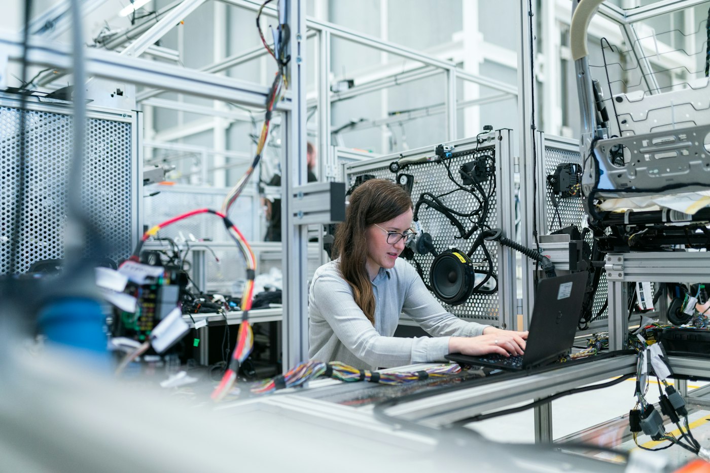Technician inspecting coated samples